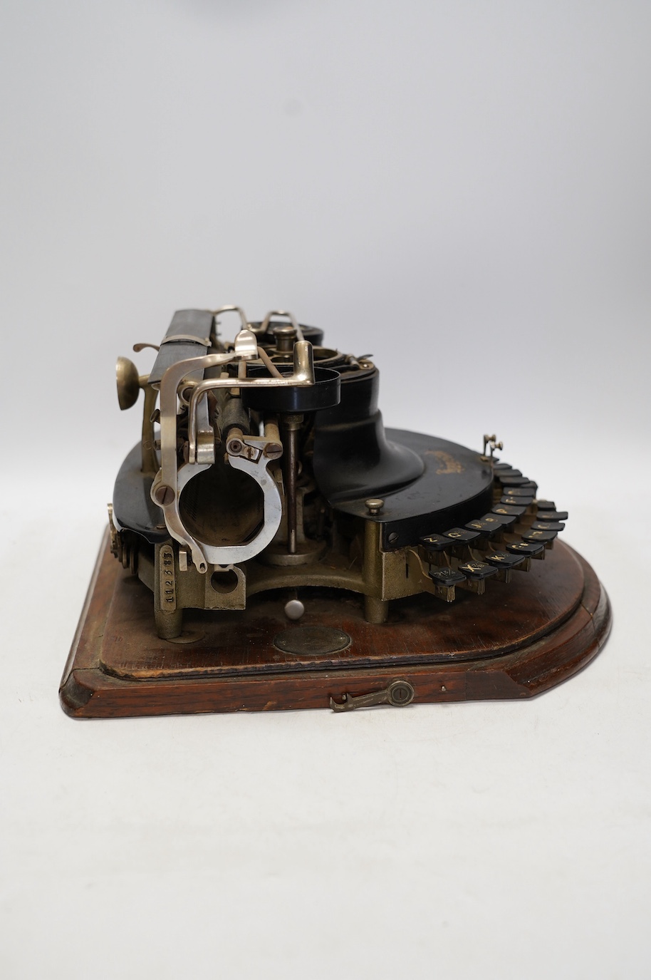 A scarce early 20th century Hammond Multiplex typewriter, with convex keyboard in an oak plywood case, case 20cm high, 35cm wide, 33cm deep. Condition - poor to fair, two keys missing and others worn or broken